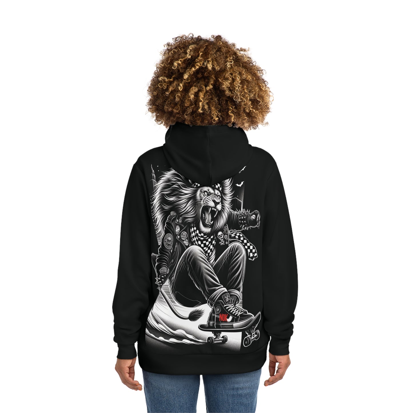 Back view of a woman wearing a black hoodie featuring a bold lion skateboarder graphic design with punk-inspired details and checkered patterns.