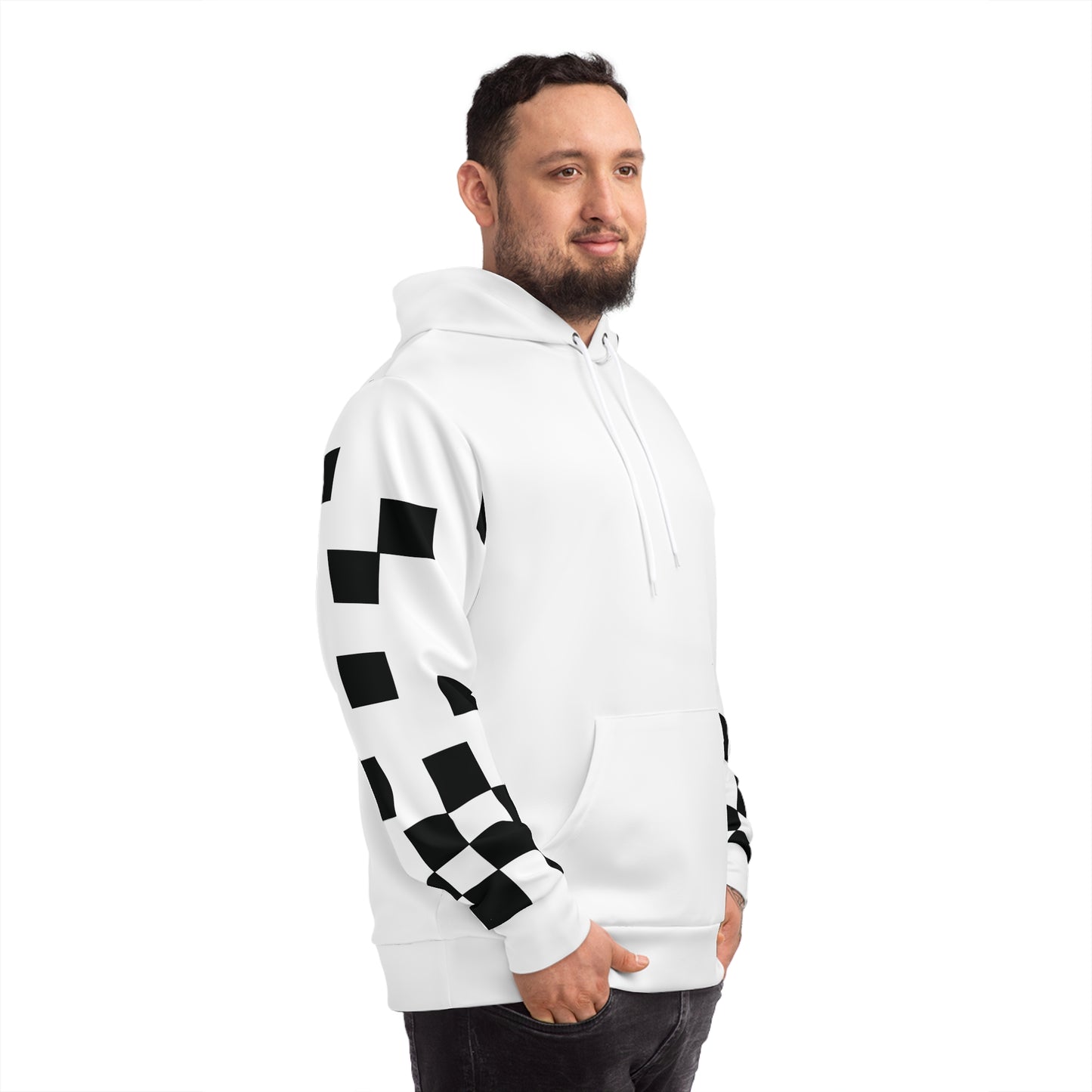 Man in a white hoodie with black checkered sleeve details, captured from a side profile.