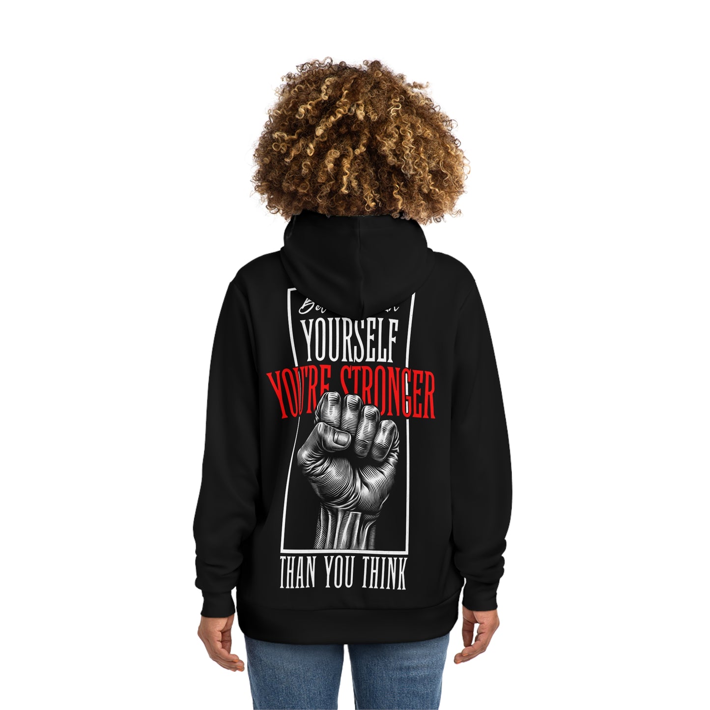 Woman modeling a black hoodie with a back design that includes an illustrated fist and the motivational message 'You're Stronger Than You Think'.