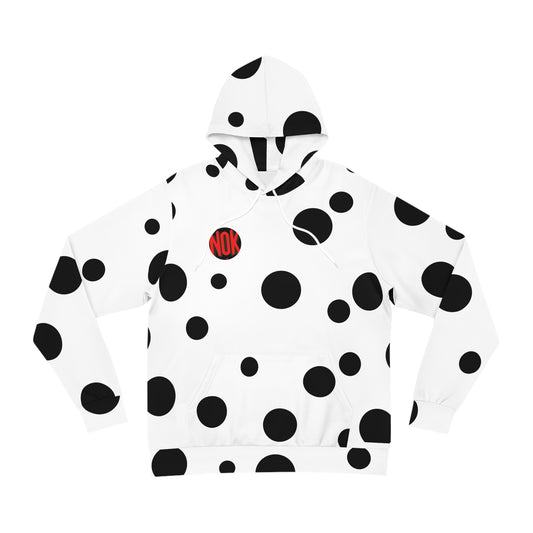 Flat lay view of the white 'Break the Pattern' hoodie featuring bold black circular patterns on the front.