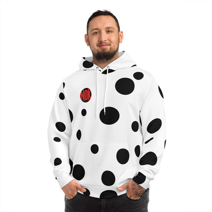 Front view of the white 'Break the Pattern' hoodie with bold black circular elements, worn by a confident man.