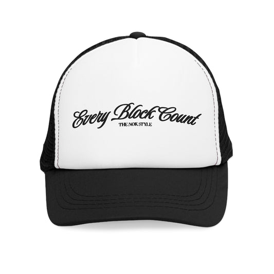 Front view close-up of the Every Block Count logo snapback cap, featuring a white base with elegant black script.