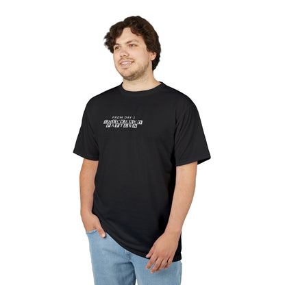 Front view of a model in the Every Block Count black t-shirt with bold text 'From Day 1 - Checkered Pattern'.