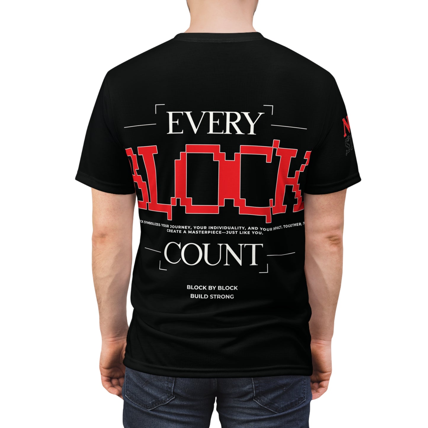 Back view of a black T-shirt modeled by a person, featuring the bold text 'Every Block Count' with pixelated design and motivational message.
