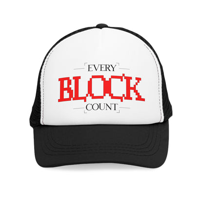 Front view of a Trucker Cap featuring a bold red pixelated 'Every Block Count' design on a white panel with a black brim.