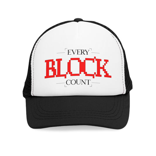 Front view of a Trucker Cap featuring a bold red pixelated 'Every Block Count' design on a white panel with a black brim.