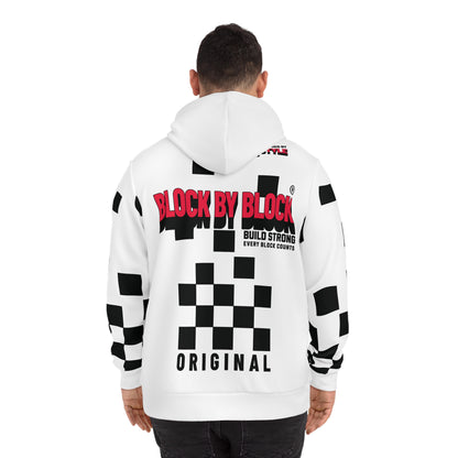 Back view of a man in a white hoodie with a bold red 'Block by Block' logo and black checkered accents.