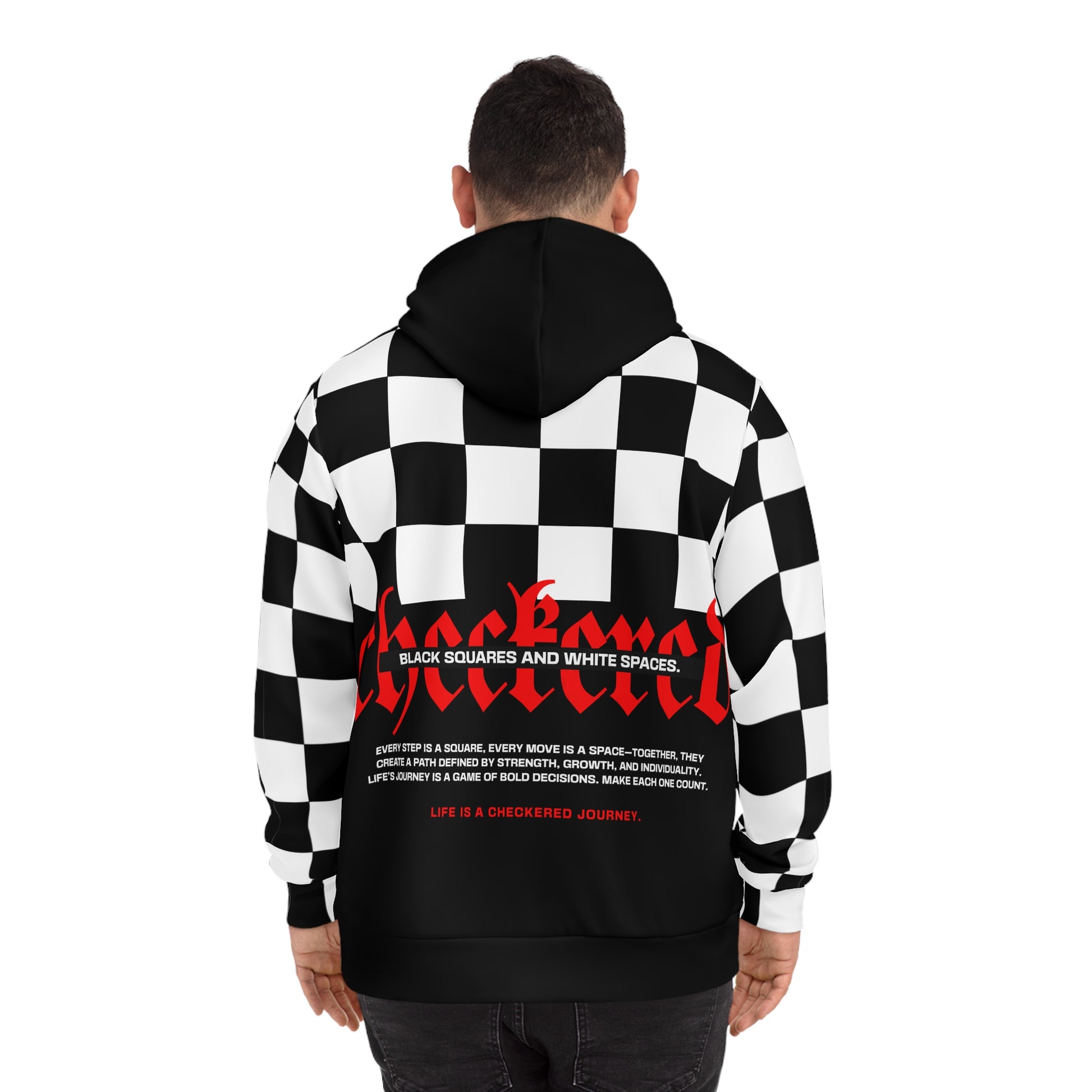 Back view of a man wearing a NOKSTYLE hoodie featuring the statement 'Life is a Checkered Journey' with bold red 'Checkmate' typography.