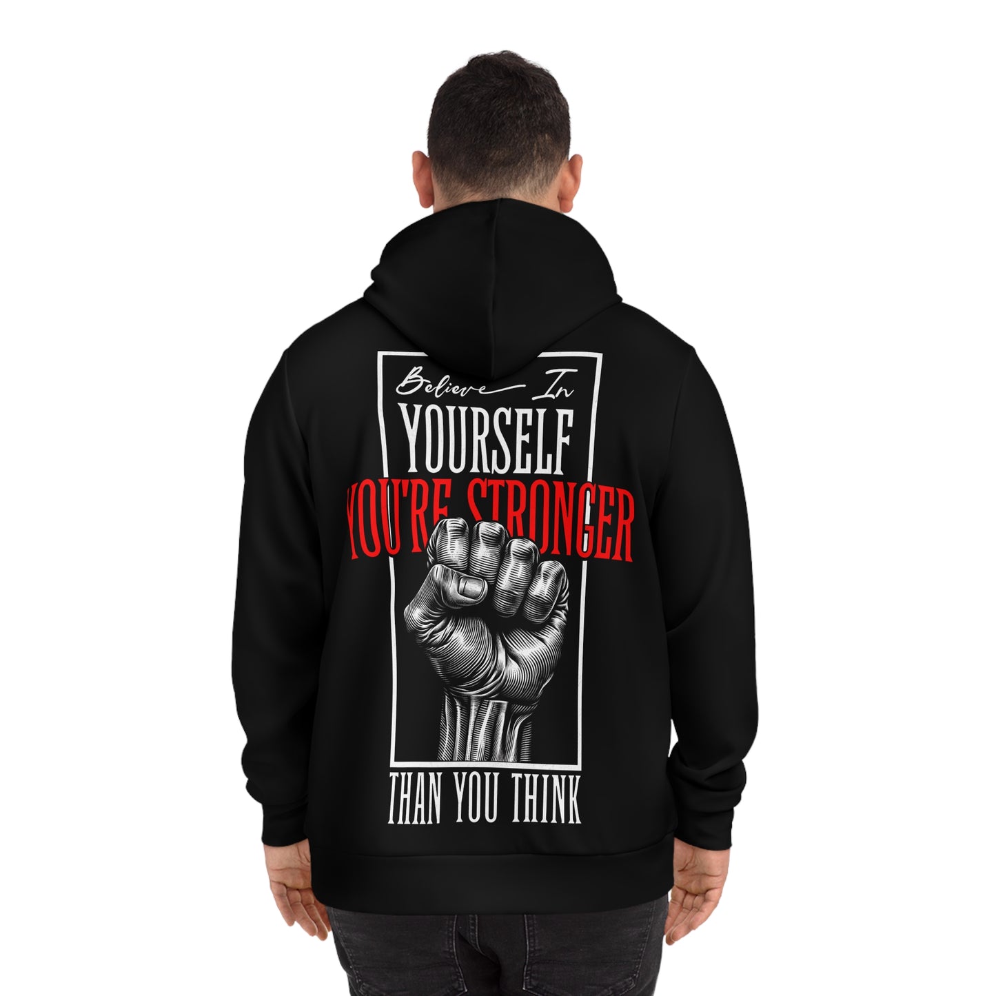 Man wearing a black hoodie, showcasing the back design with a motivational quote and detailed fist artwork.