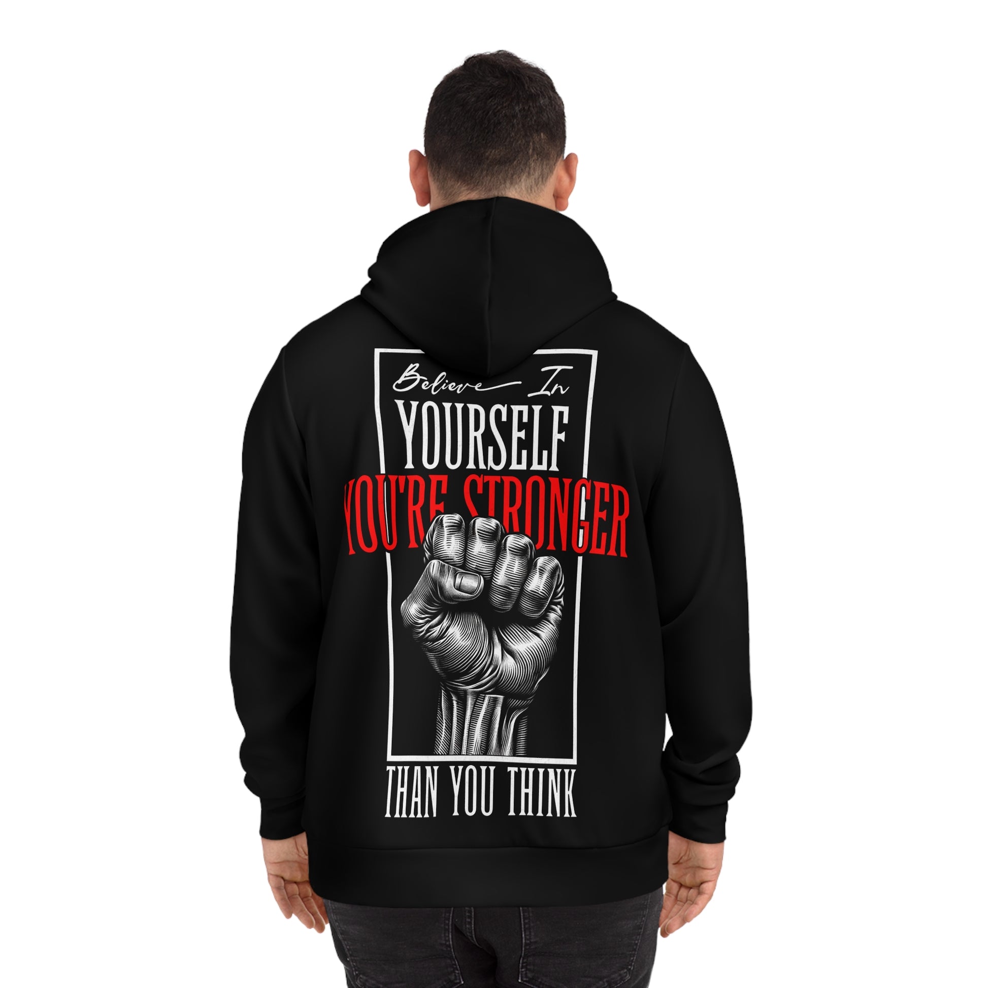 Man wearing a black hoodie, showcasing the back design with a motivational quote and detailed fist artwork.