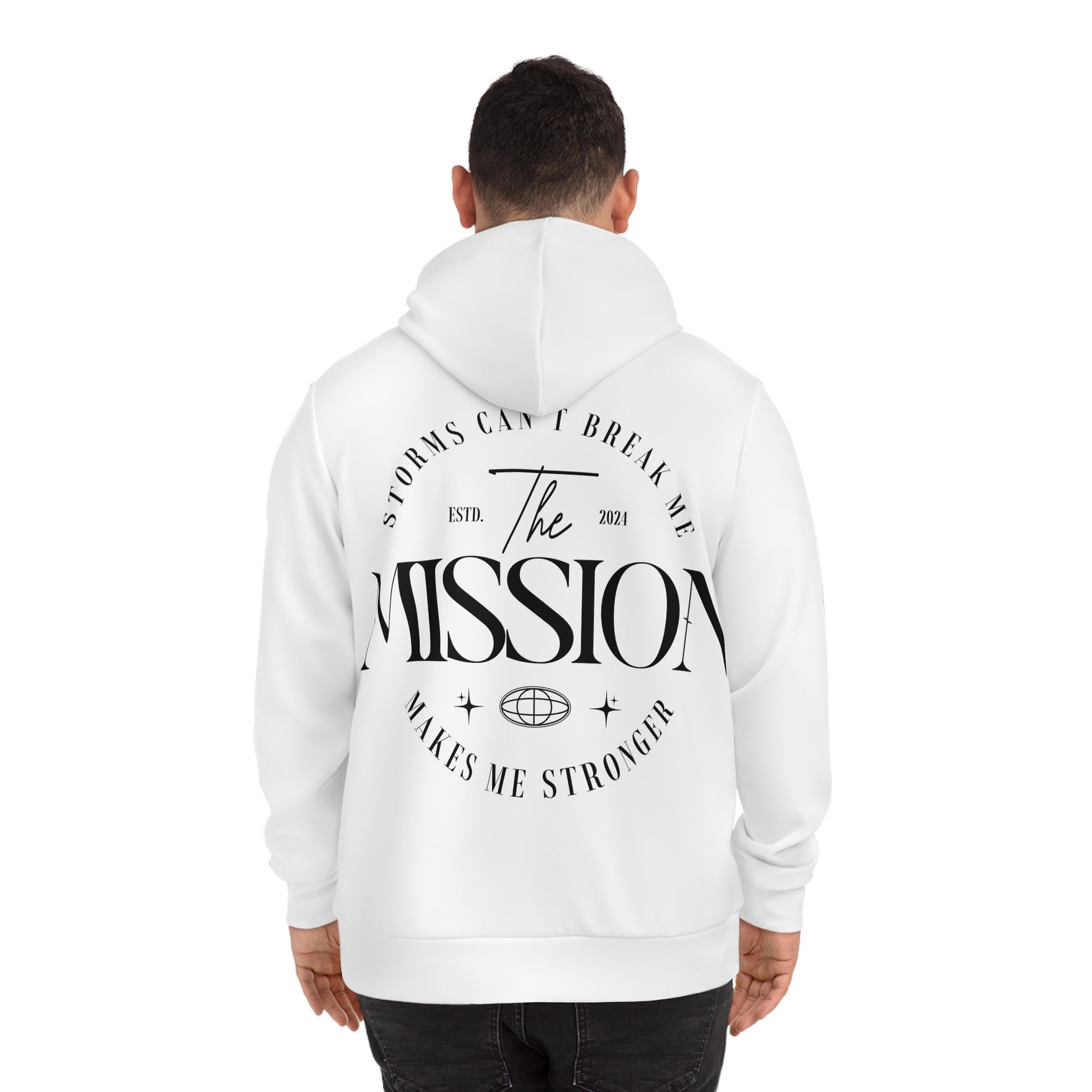 Back view of a man wearing a white hoodie featuring the text 'Storms Can’t Break Me. Makes Me Stronger. The Mission,' with elegant typography for a motivational look.