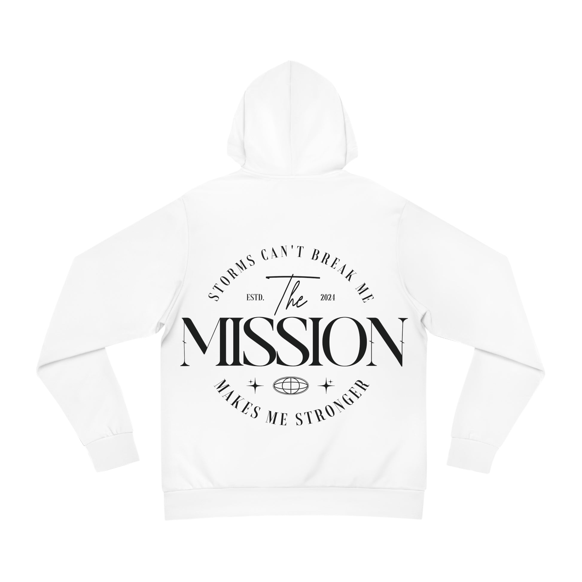 Flat lay of a white hoodie with bold typography on the back reading 'Storms Can’t Break Me. Makes Me Stronger. The Mission.