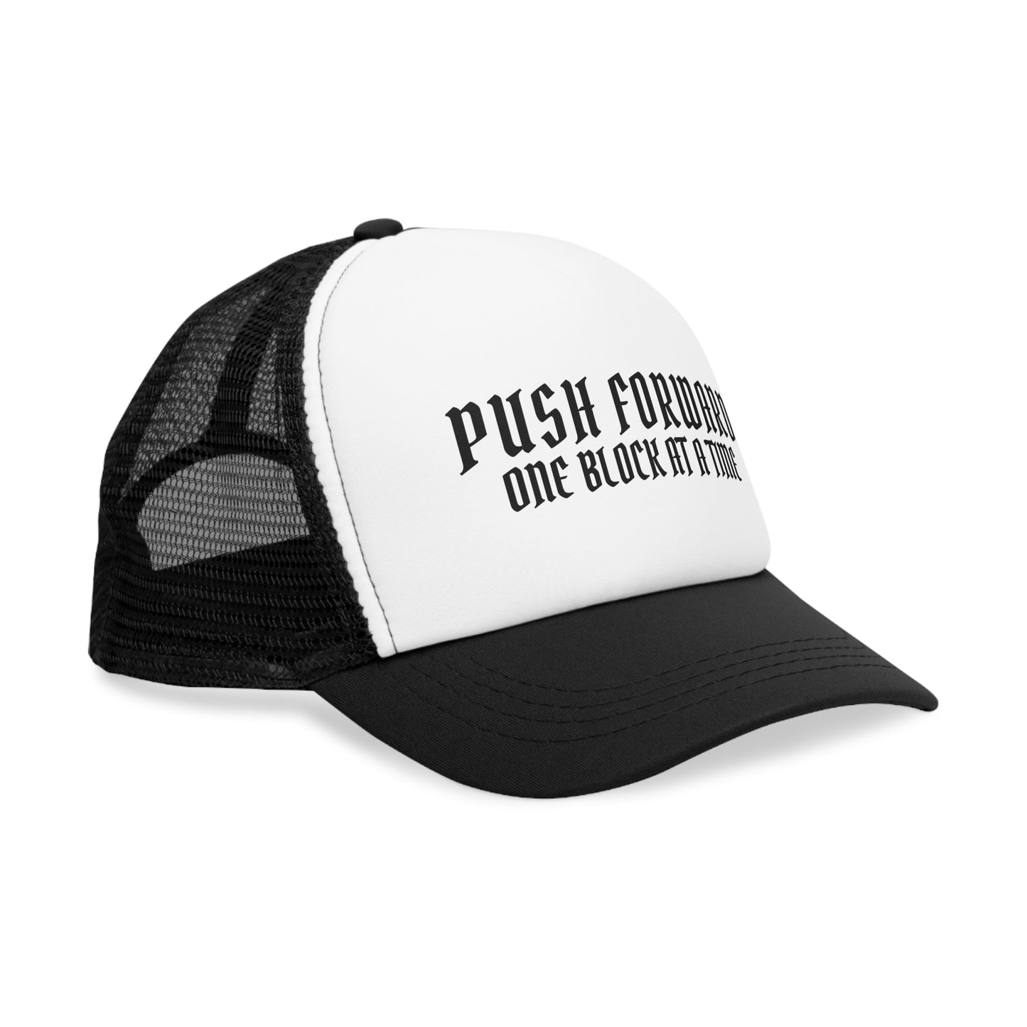 Side view of the black and white trucker cap with the motivational phrase 'Push Forward, One Block at a Time' visible on the crown.