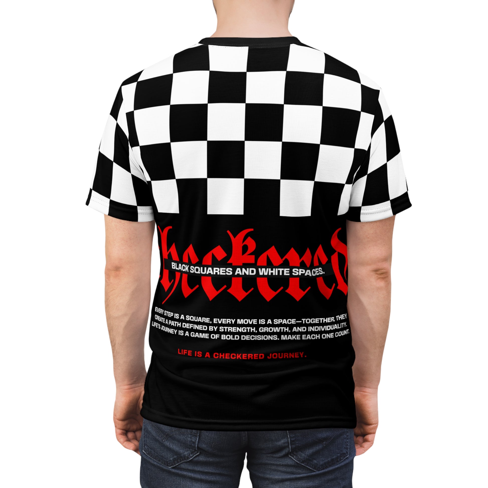 Model wearing the Checkered Victory T-shirt showcasing its bold back design with checkered blocks, red 'CHECKERED' text, and motivational words 'Life is a Checkered Journey.
