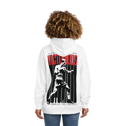 Back view of a woman wearing the Victorious hoodie showcasing a boxing-themed graphic with red and black typography reading 'Victorious – Embrace the Struggle.