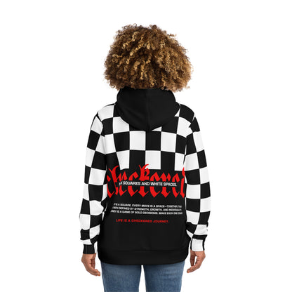 Back view of a woman wearing a NOKSTYLE hoodie with checkered patterns and a bold red text 'Checkmate' design, showcasing individuality and resilience.