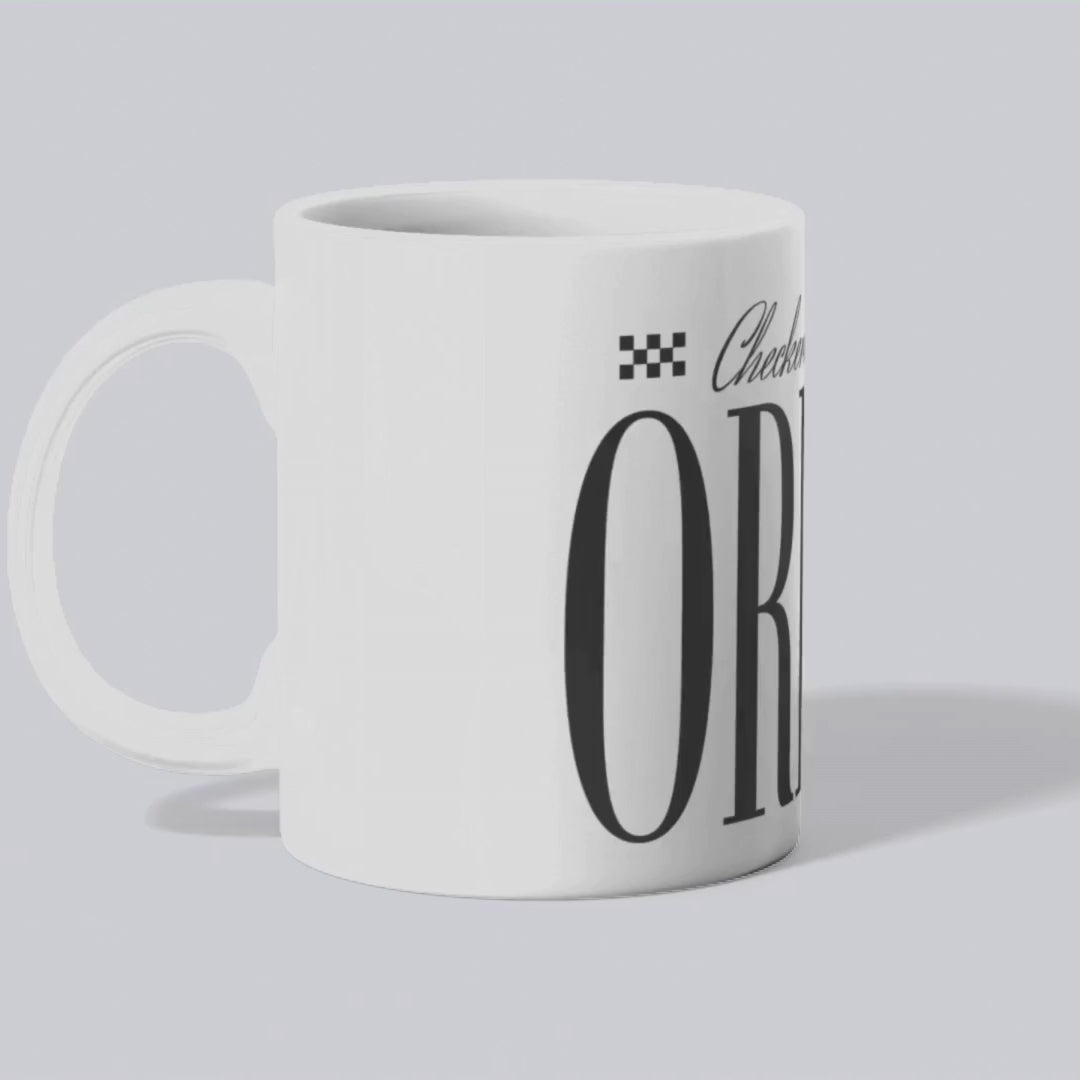 High-quality porcelain mug with bold 'Origin' design text