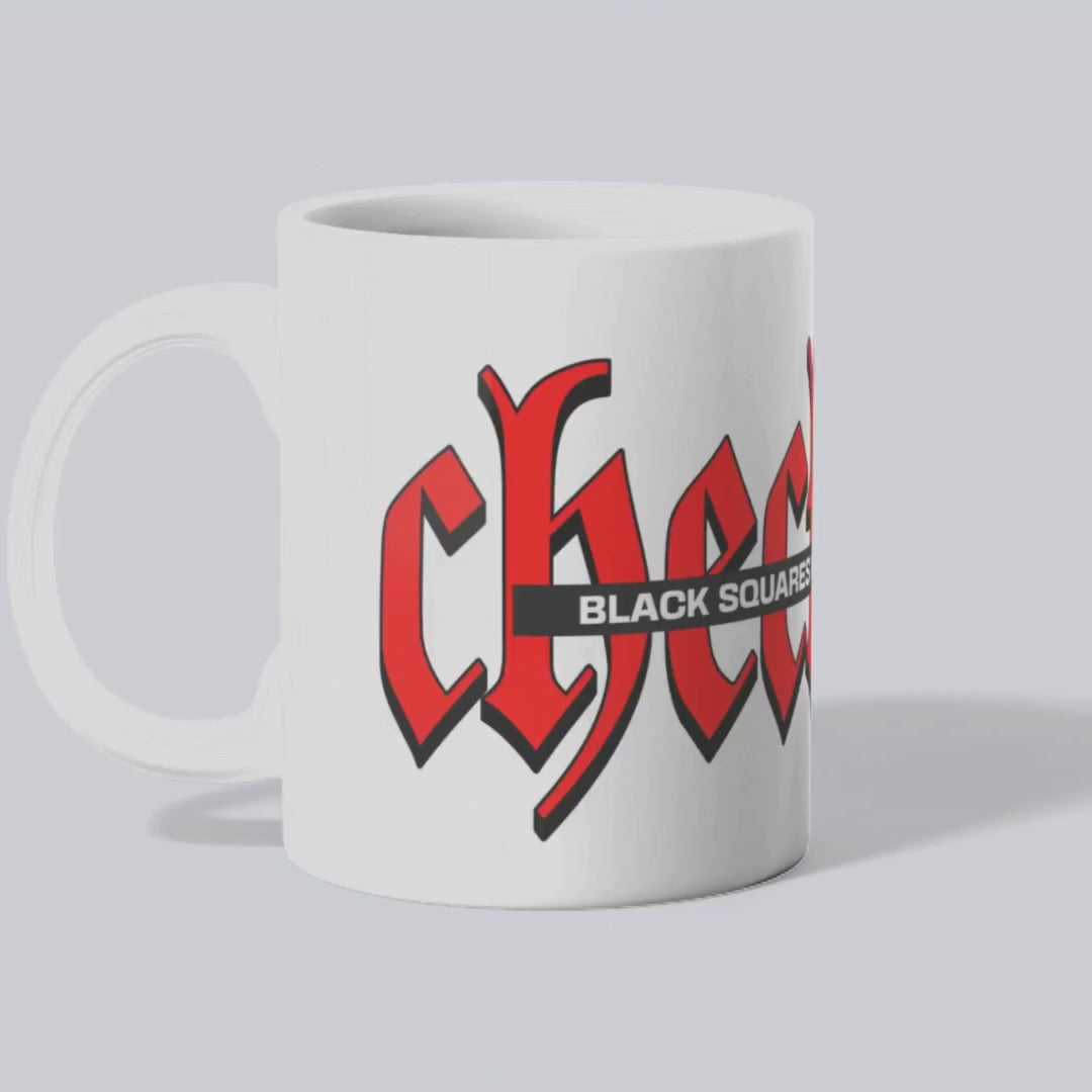 Animated white ceramic mug showcasing the rotating 'Checkered' design in red, with black text 'Black Squares and White Spaces' horizontally crossing the bold letters.